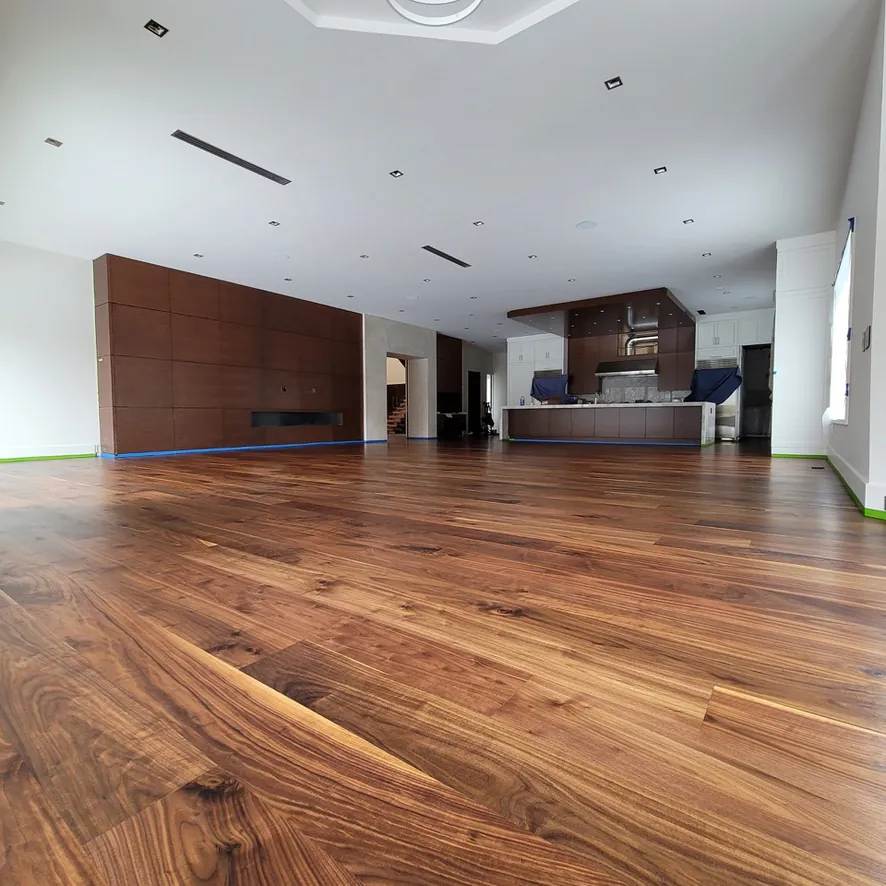 Rich grain solid oak hardwood planks installed in a light-filled premium living room layout.
